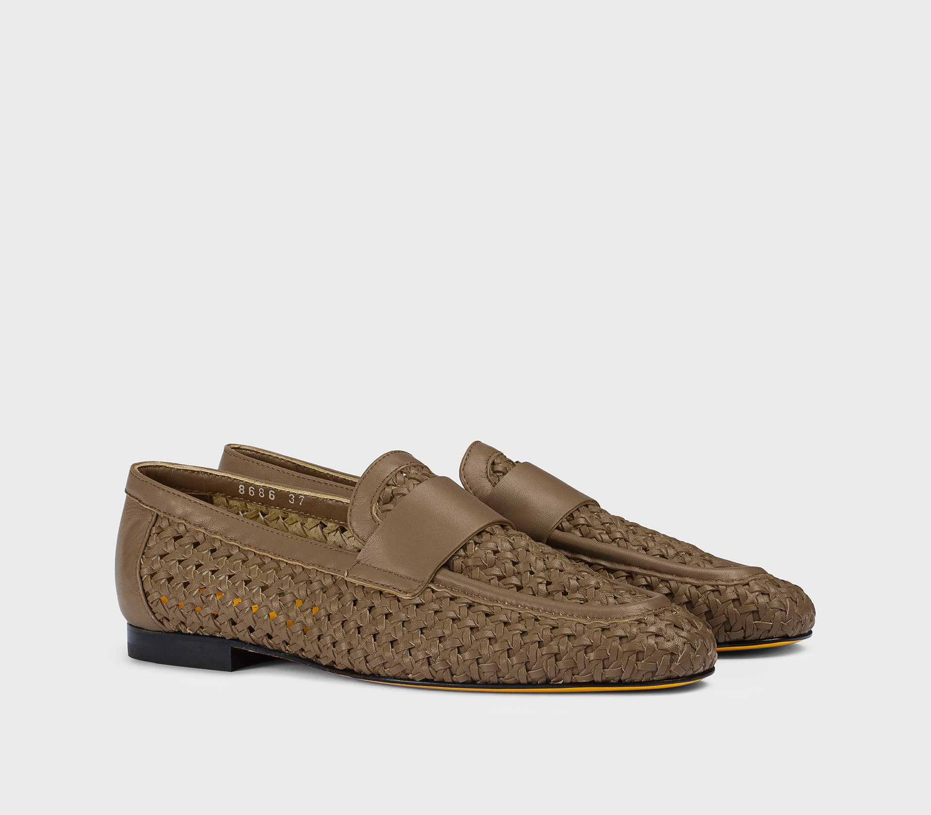 Mud-coloured openwork leather loafer