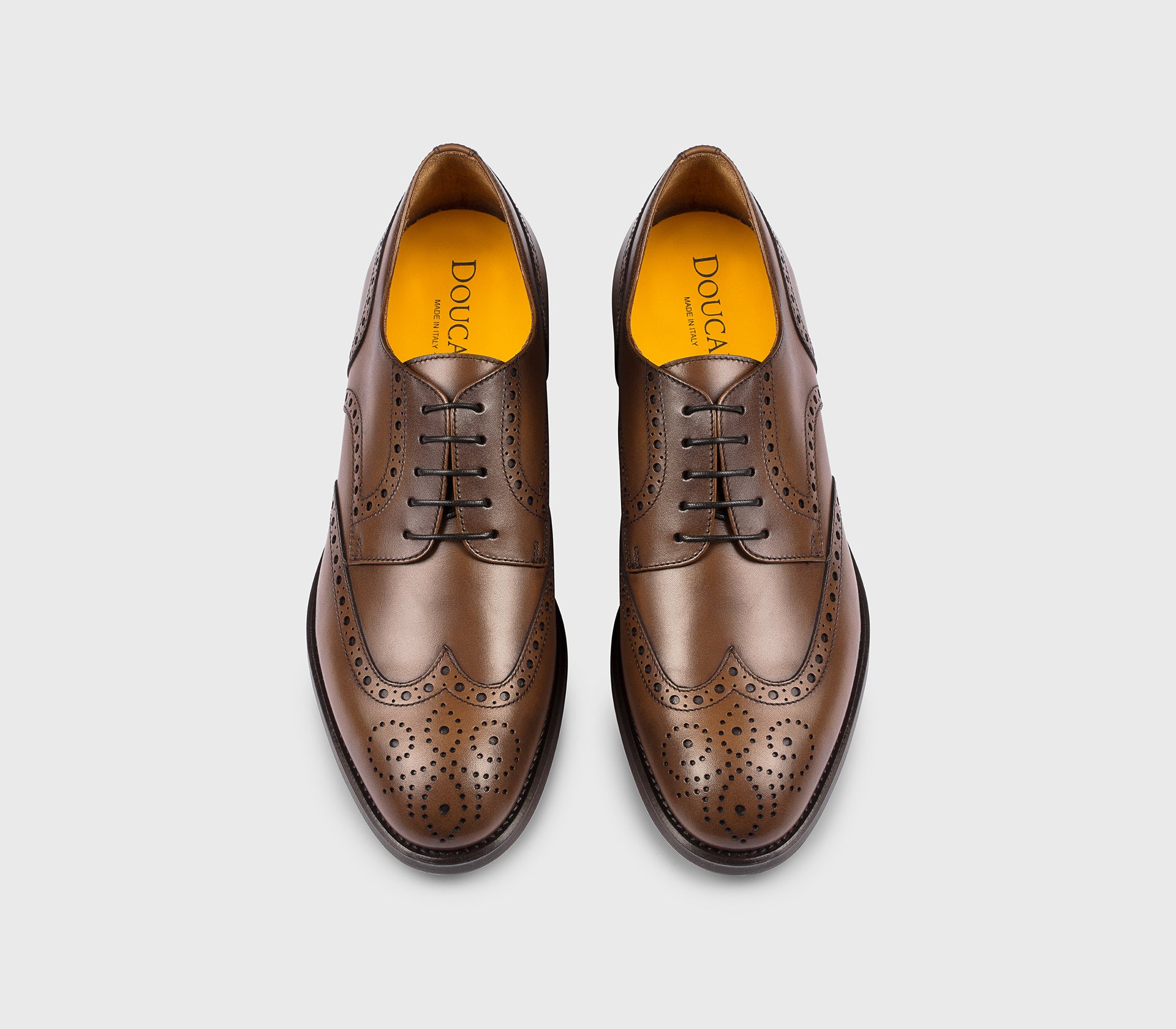 DU1036ORVNUF253TM04 - Stringata coda di rondine in pelle marrone